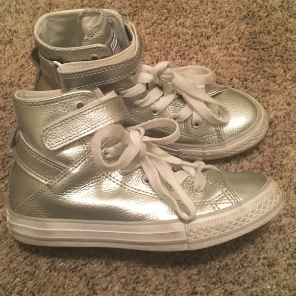 silver high top tennis shoes